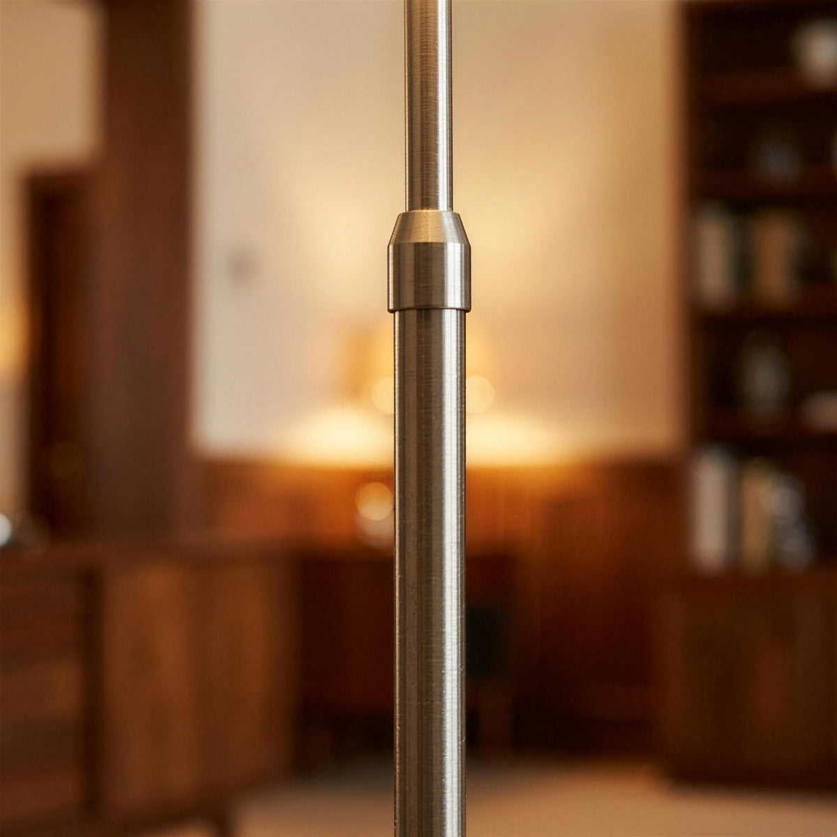 Close-up of the Ardo arc floor lamp adjustable brushed steel post and joint collar