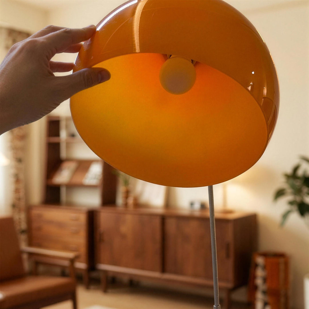 Underside of the Ardo orange acrylic dome lampshade showing the round globe bulb inside