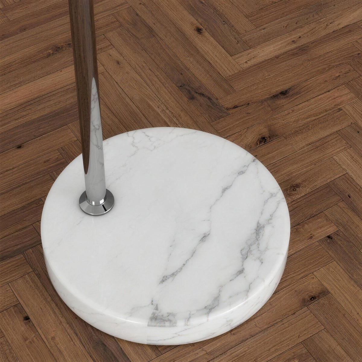 Close-up of the Ardo arc floor lamp round white marble base on a wooden floor
