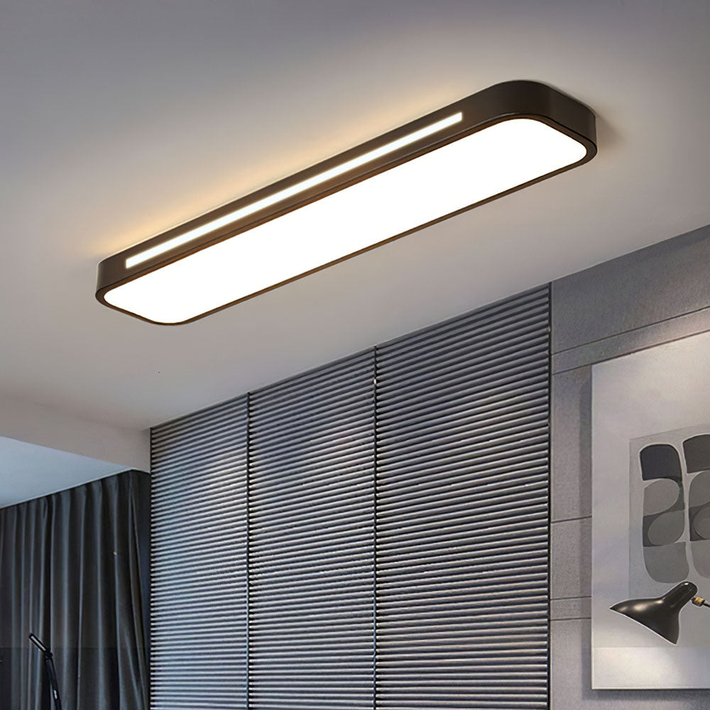 Black modern linear LED atio ceiling lamp installed in a room featuring grey slatted wall panels