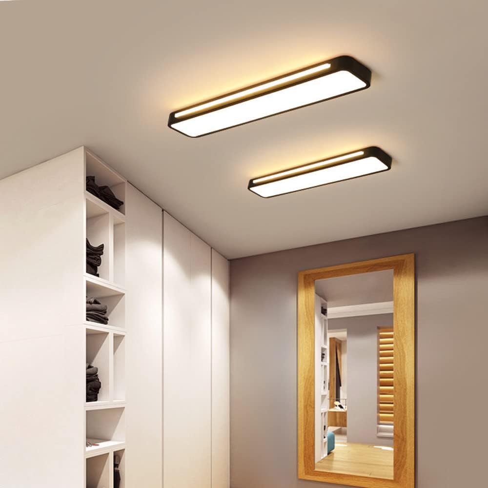 Pair of black ultra-thin linear LED atio ceiling lights illuminating a modern walk-in wardrobe