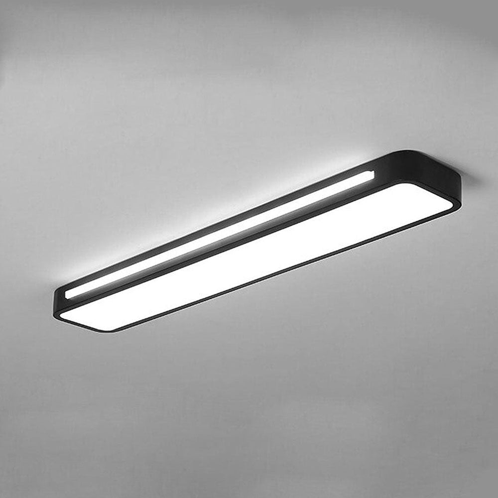 Illuminated modern black LED linear atio ceiling light showing a bright, even light diffusion