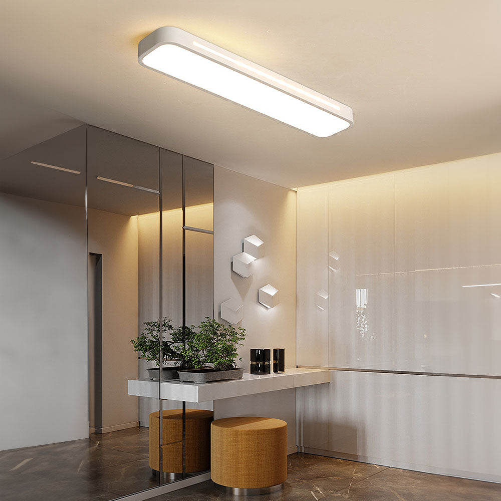 Modern white linear flush mount atio ceiling light providing bright illumination in a stylish entryway