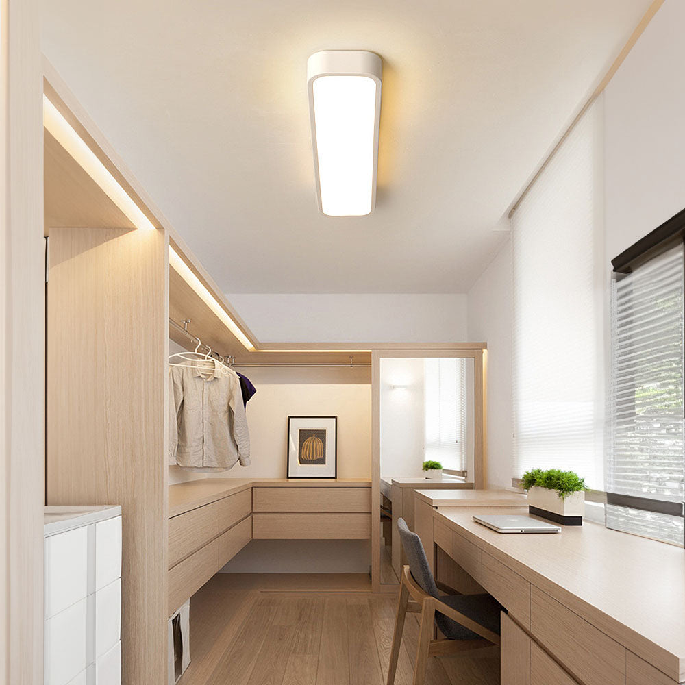 Bright white linear LED flush atio ceiling light illuminating a modern home office and vanity area