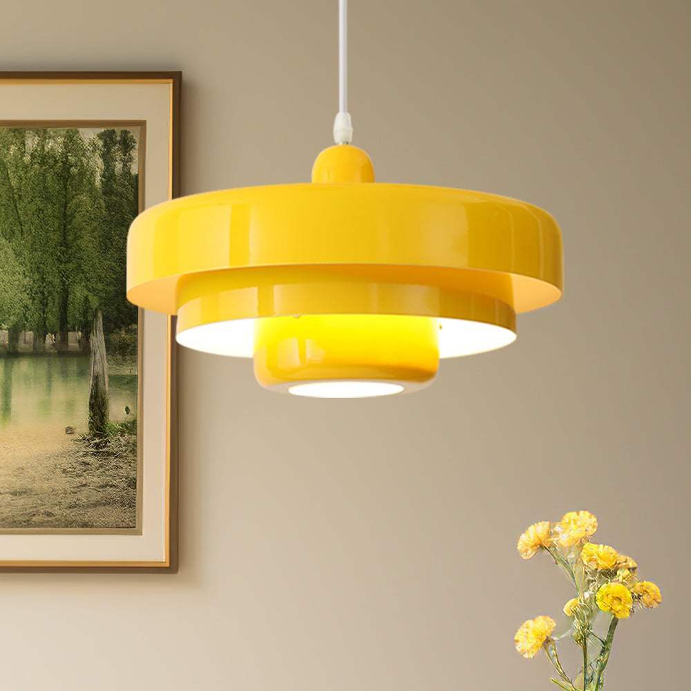 Cheerful yellow Bauhaus balel layered pendant light illuminating a classic interior with artwork