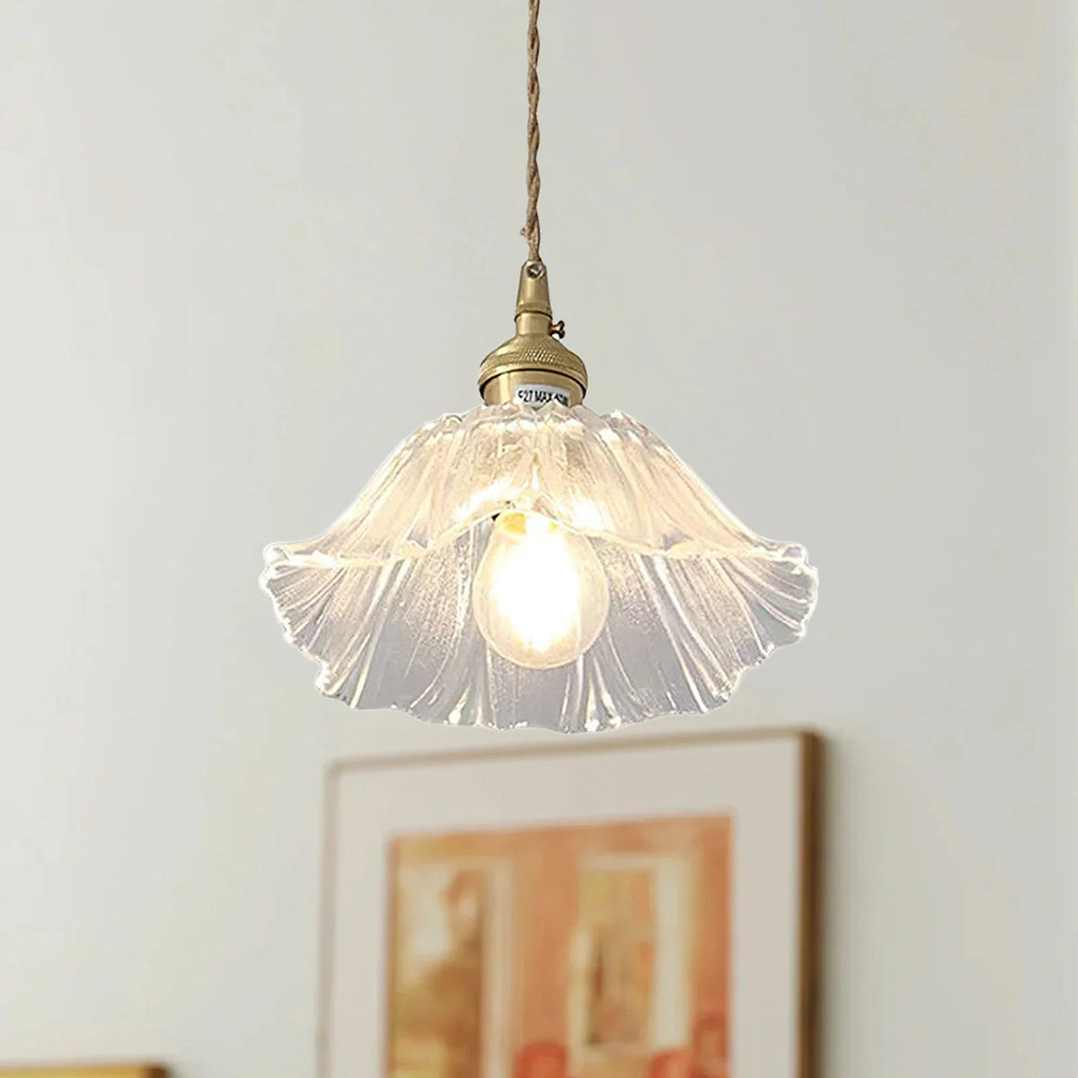 Clear vintage lotus glass bila pendant light with a fluted retro design glowing softly