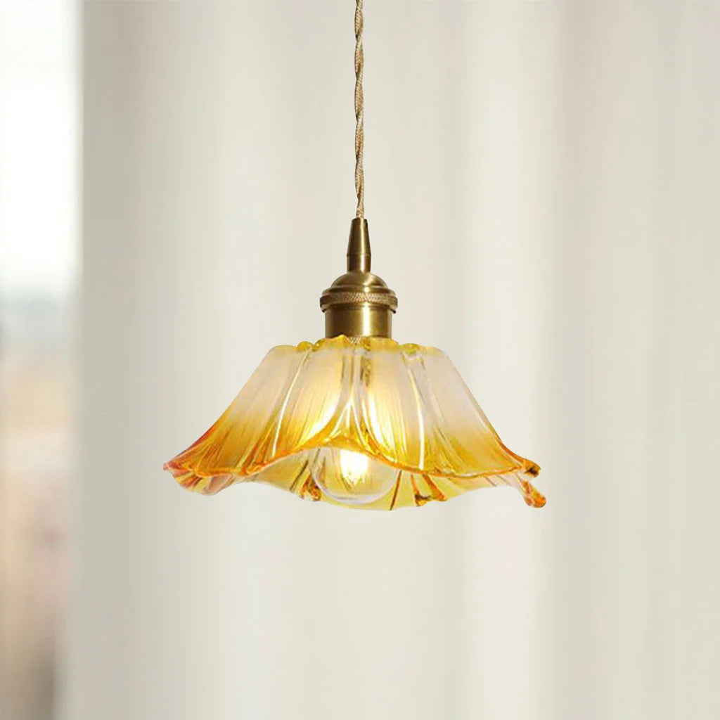 Yellow retro fluted bila dome pendant lamp glowing warmly against a plain wall
