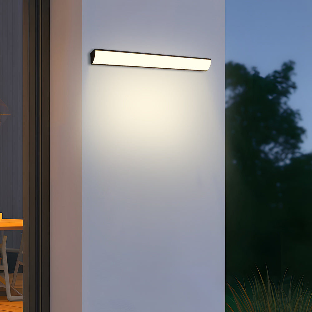 Horizontal waterproof LED bubce wall light casting a bright, even glow on a white exterior wall