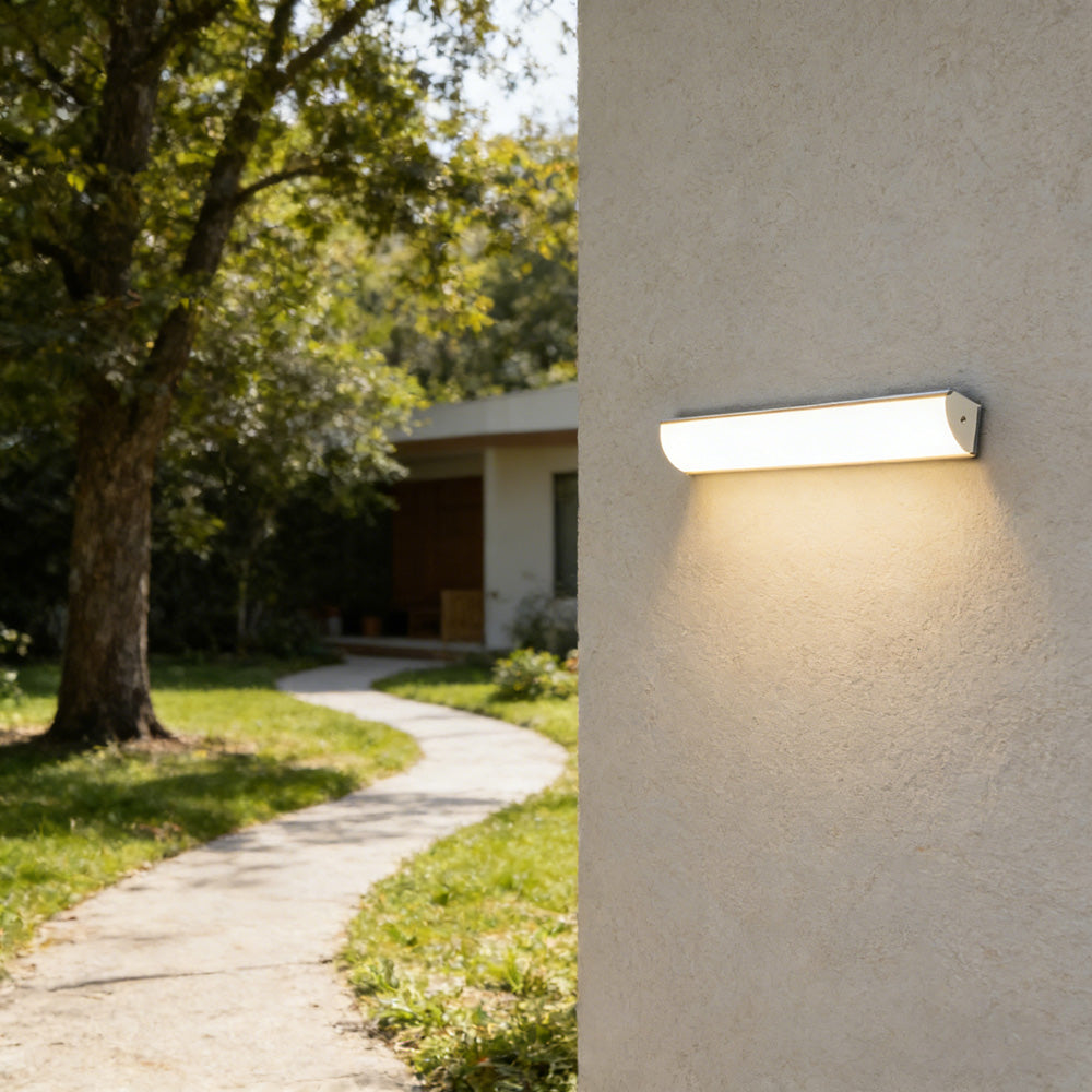 bubce waterproof linear LED wall light illuminating a lush green garden pathway