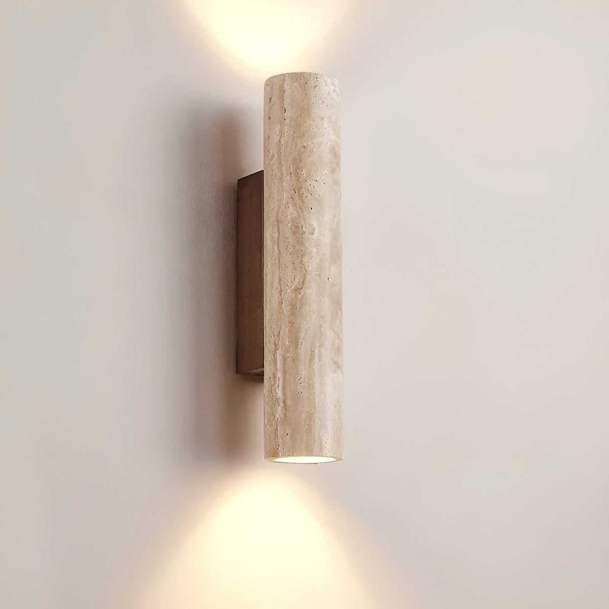 Japandi style natural stone bura wall light illuminating a minimalist interior with its dual emission beam