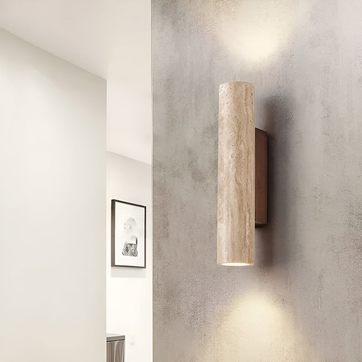 Organic stone bura wall sconce acting as a beautiful architectural accent on a textured hallway wall