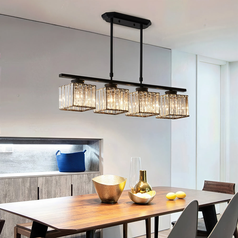 Black 4-light square ribbed glass butel pendant suspended over a long wooden dining table