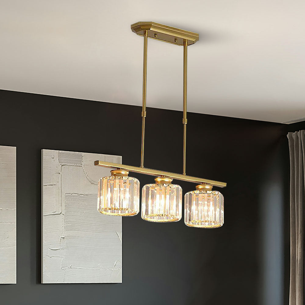 Gold 3-light round ribbed glass butel pendant casting a warm glow over a dark sideboard