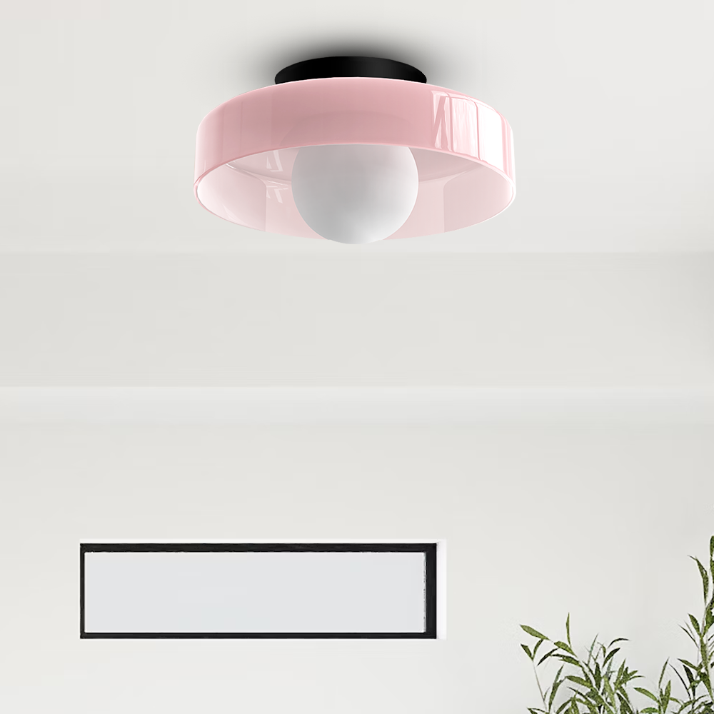 Pink glass disc flush mount cenas ceiling light in a romantic, light-filled bedroom