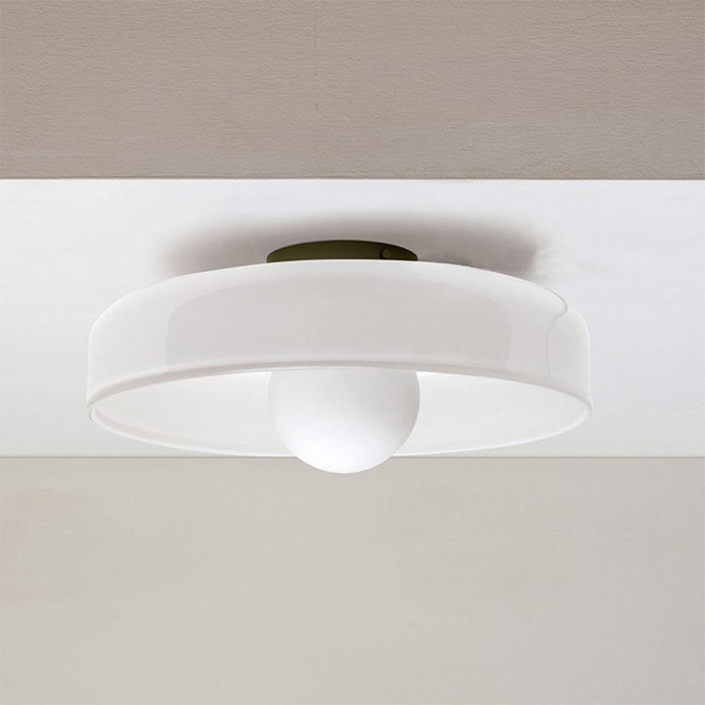 White glass disc cenas ceiling lamp providing clean, minimalist illumination
