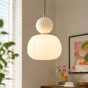 Beige debz Bauhaus macaron pendant light providing warm, diffused illumination in a modern room