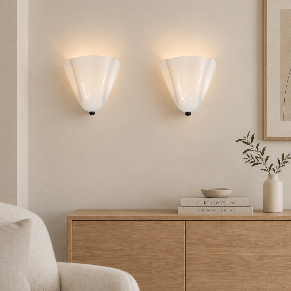 Pair of Drel amber tulip glass wall sconces, modern British lifestyle setting