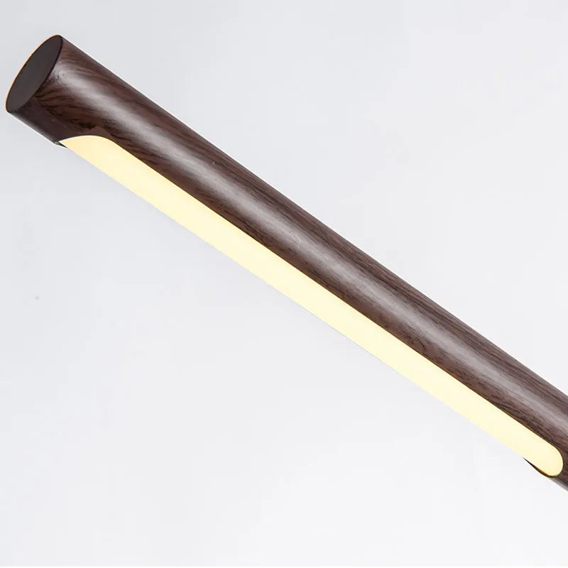 Close-up of the Elkon walnut light bar end with its LED strip lit