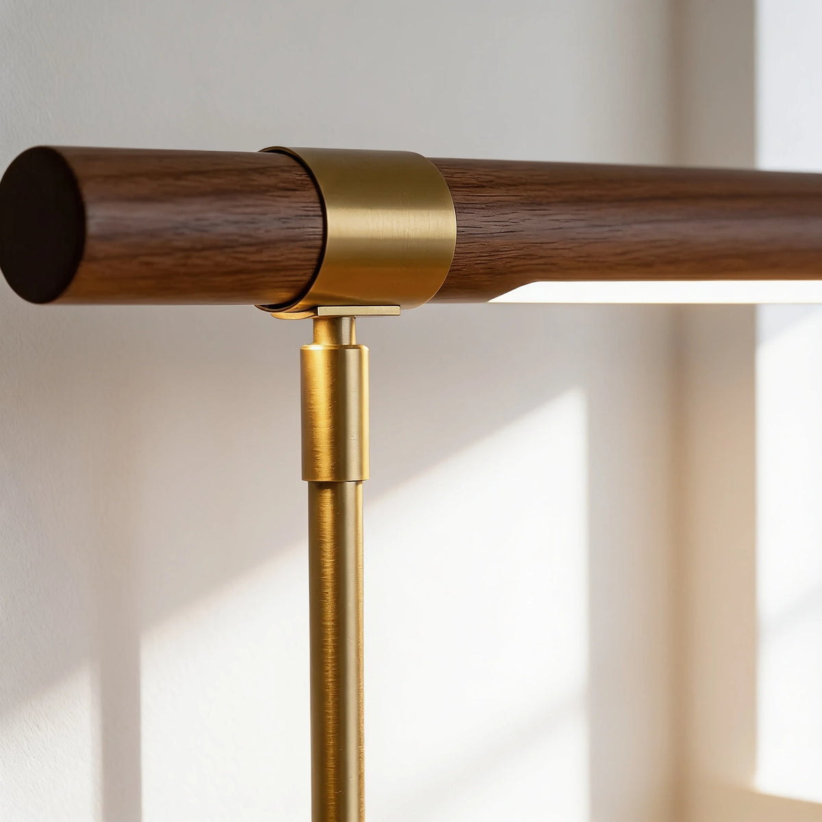 Close-up of the Elkon walnut T-bar head and brass collar