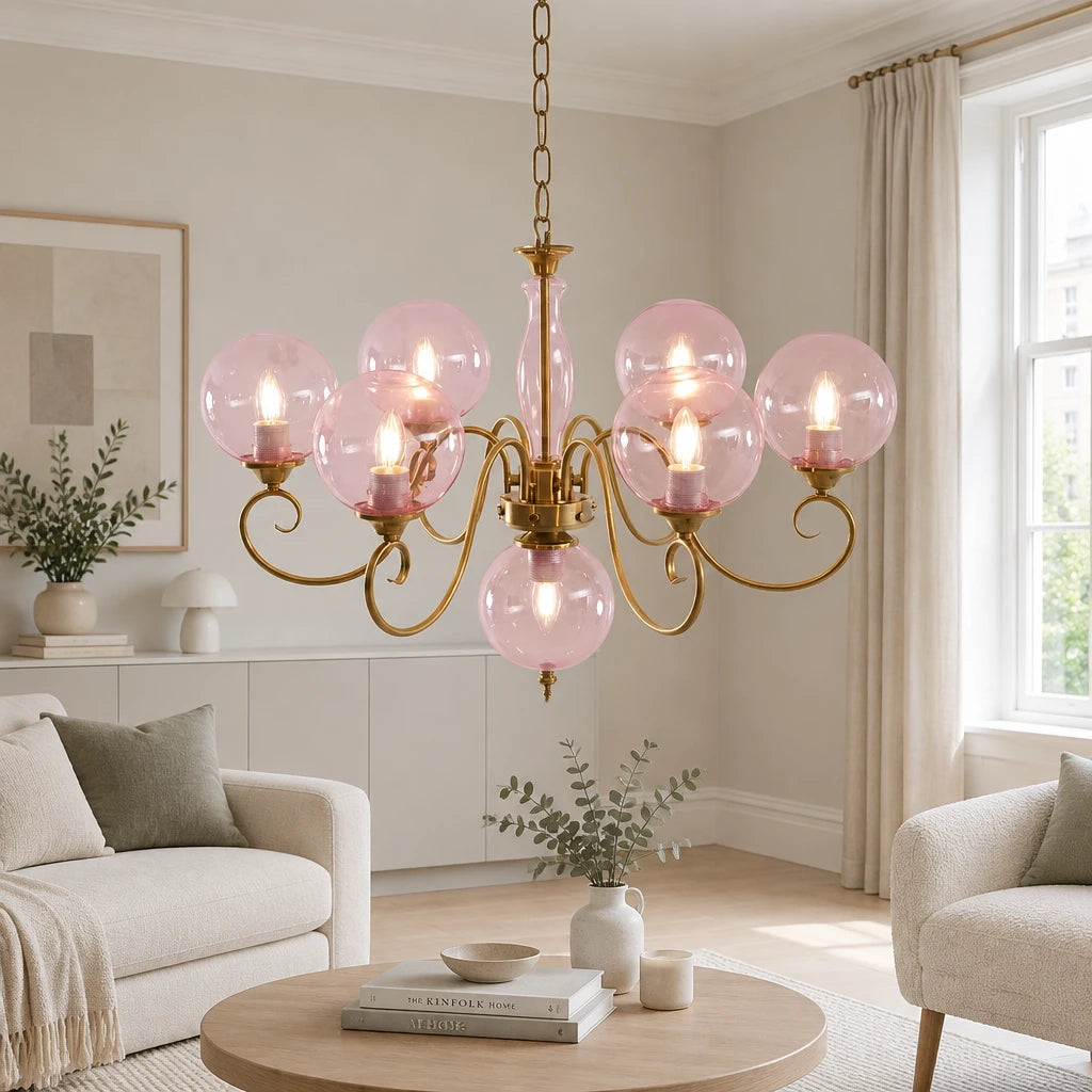 Elur brass-finish iron chandelier, 6+1 globes, Blush Pink hand-blown glass, in a modern British minimalist living room