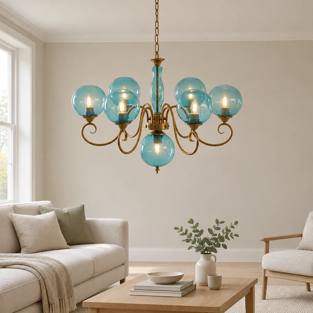 Elur brass-finish iron chandelier, 6+1 globes, Pale Blue hand-blown glass, in a modern British minimalist living room