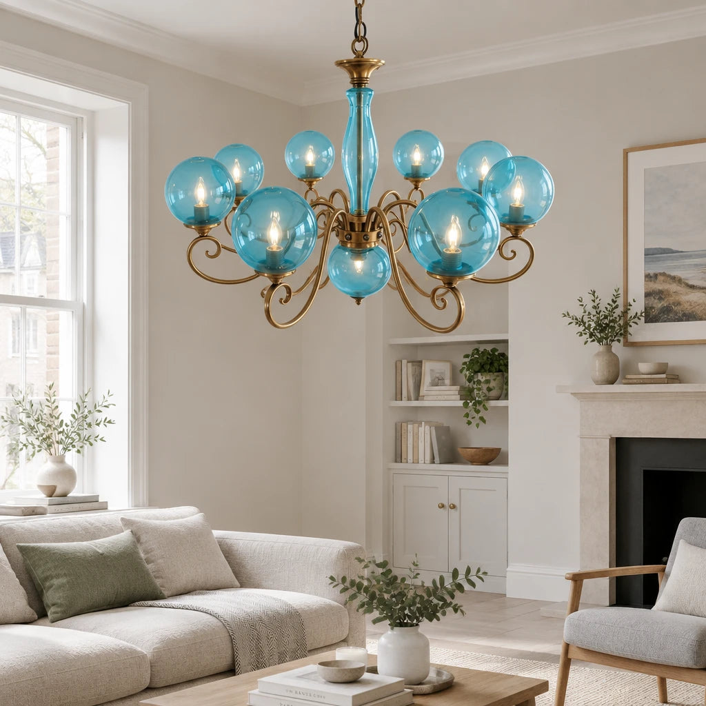 Elur brass-finish iron chandelier, 8+1 globes, Pale Blue hand-blown glass, in a modern British minimalist living room
