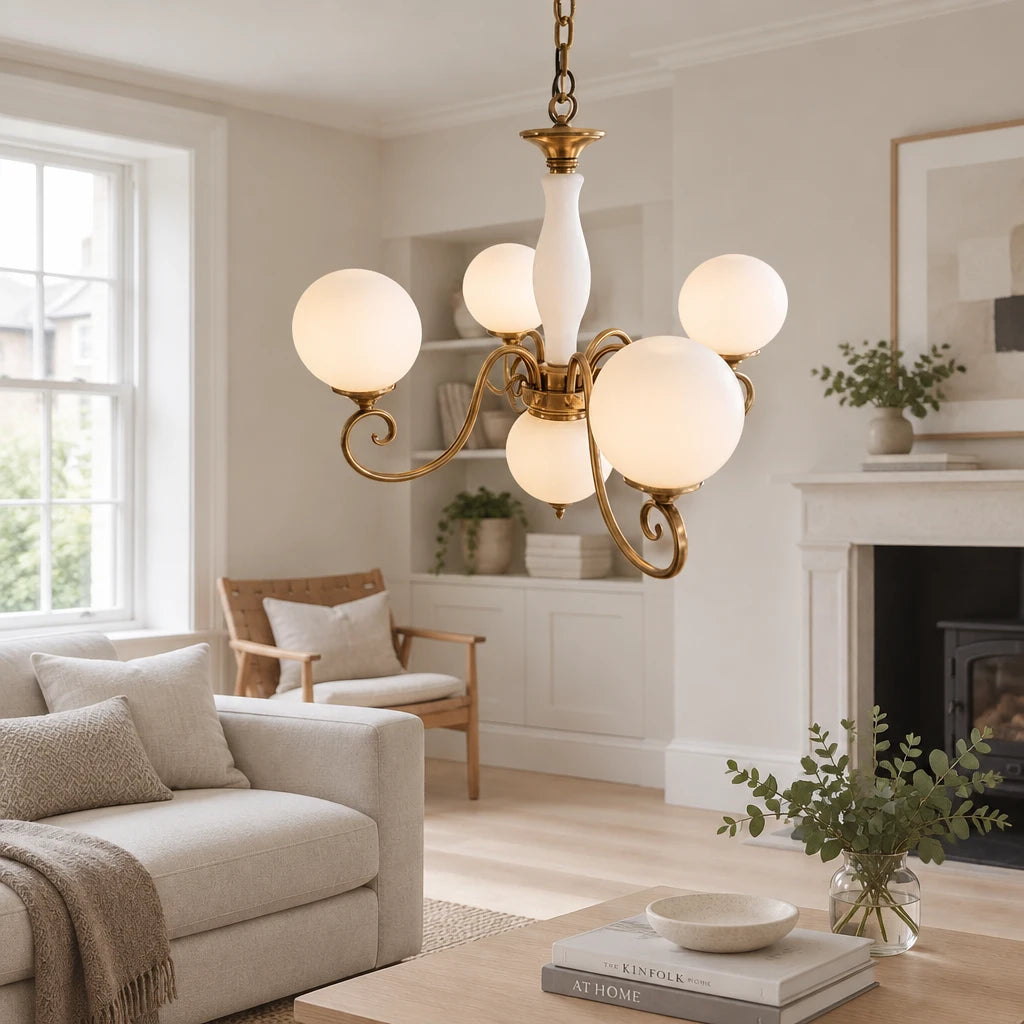 Elur brass-finish iron chandelier, 4+1 globes, Milky White hand-blown glass, in a modern British minimalist living room