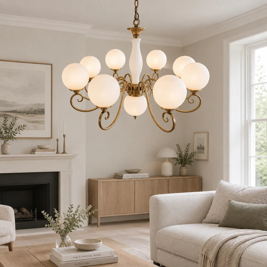 Elur brass-finish iron chandelier, 8+1 globes, Milky White hand-blown glass, in a modern British minimalist living room