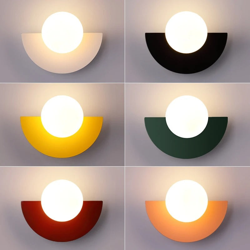 fers colour variants for the geometric globe sconce, showcasing white, black, yellow, green, red, and orange finishes