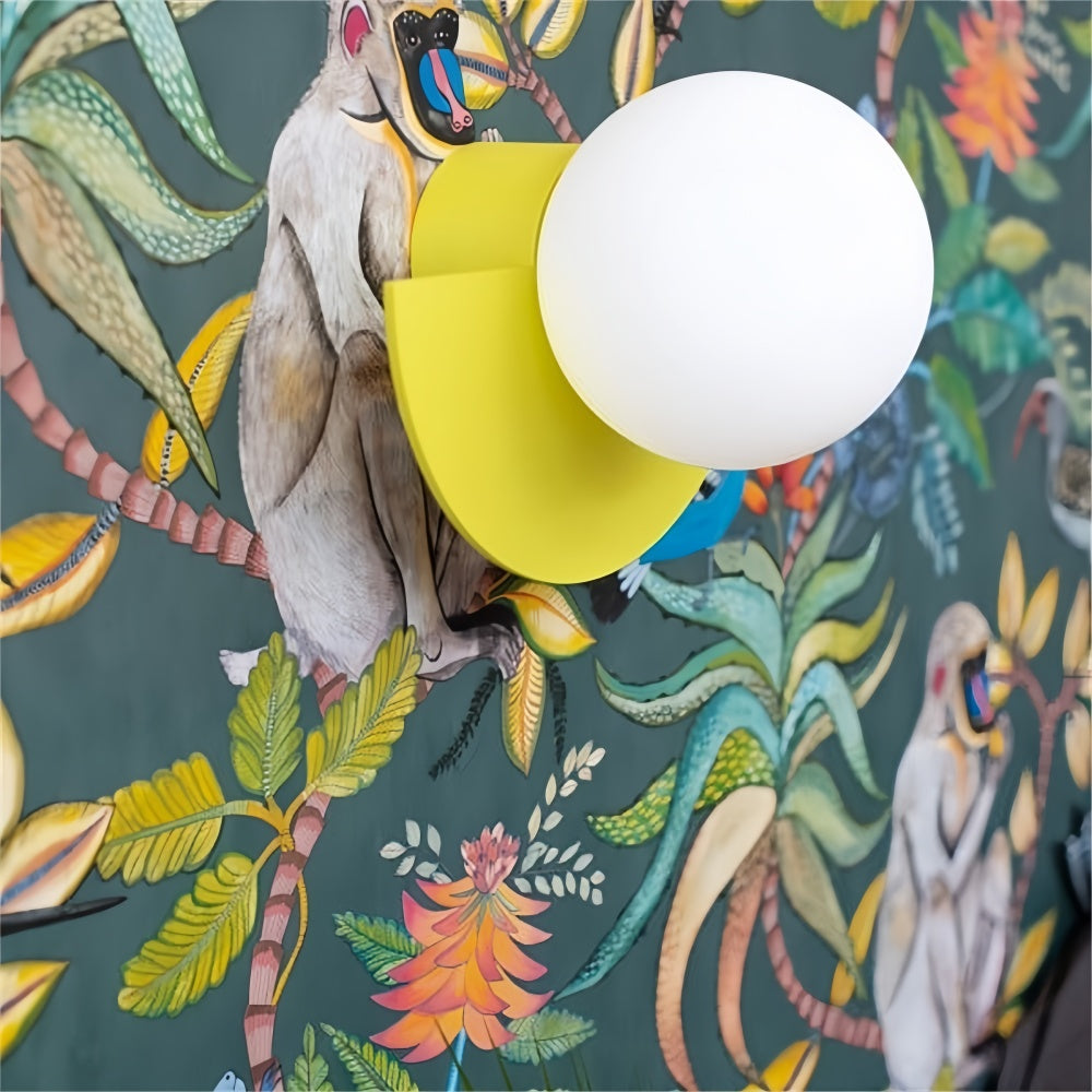Bright yellow semi-circle fers wall sconce highlighting fun tropical botanical wallpaper