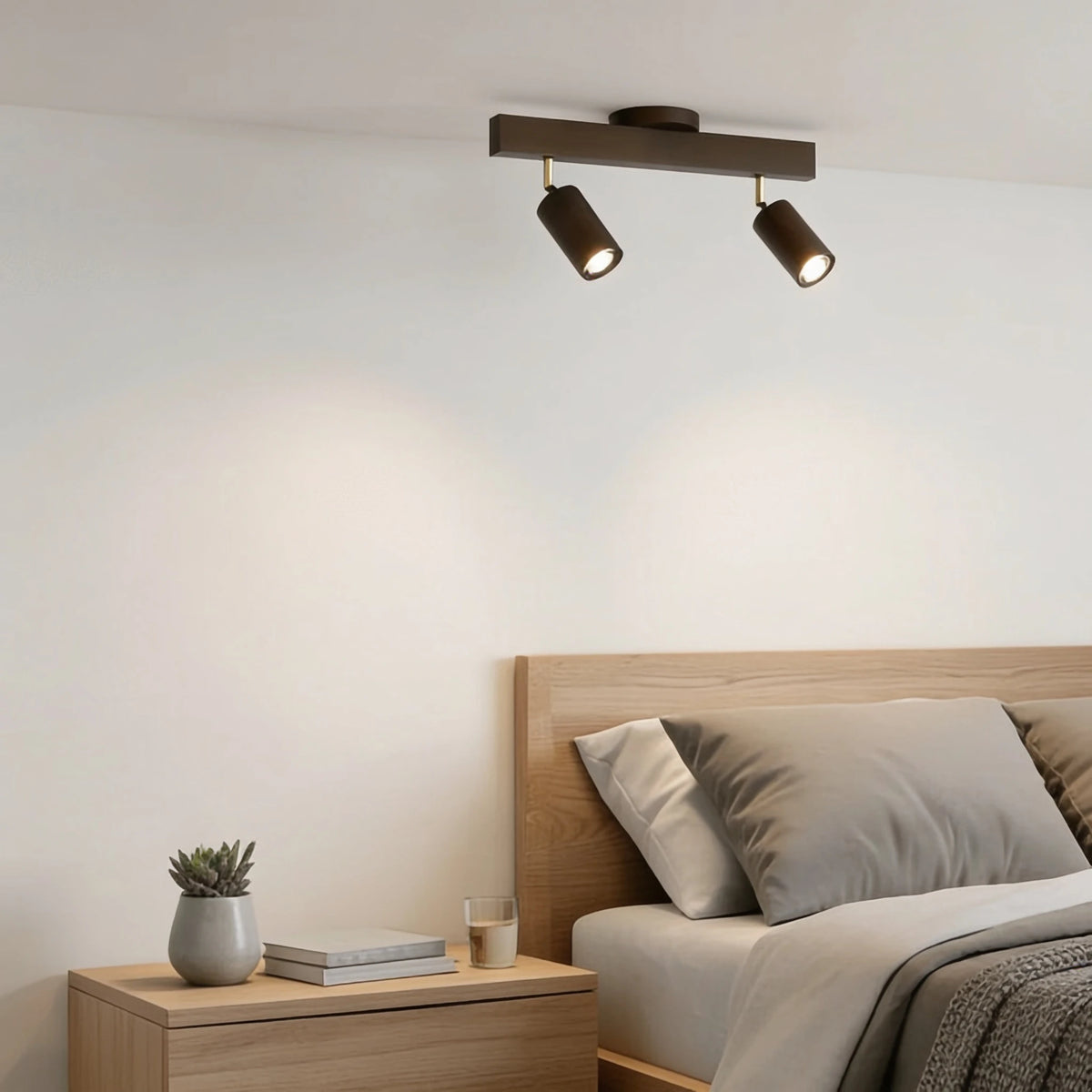 Flar 2 head walnut ceiling spotlight bar above a bed in a minimalist bedroom