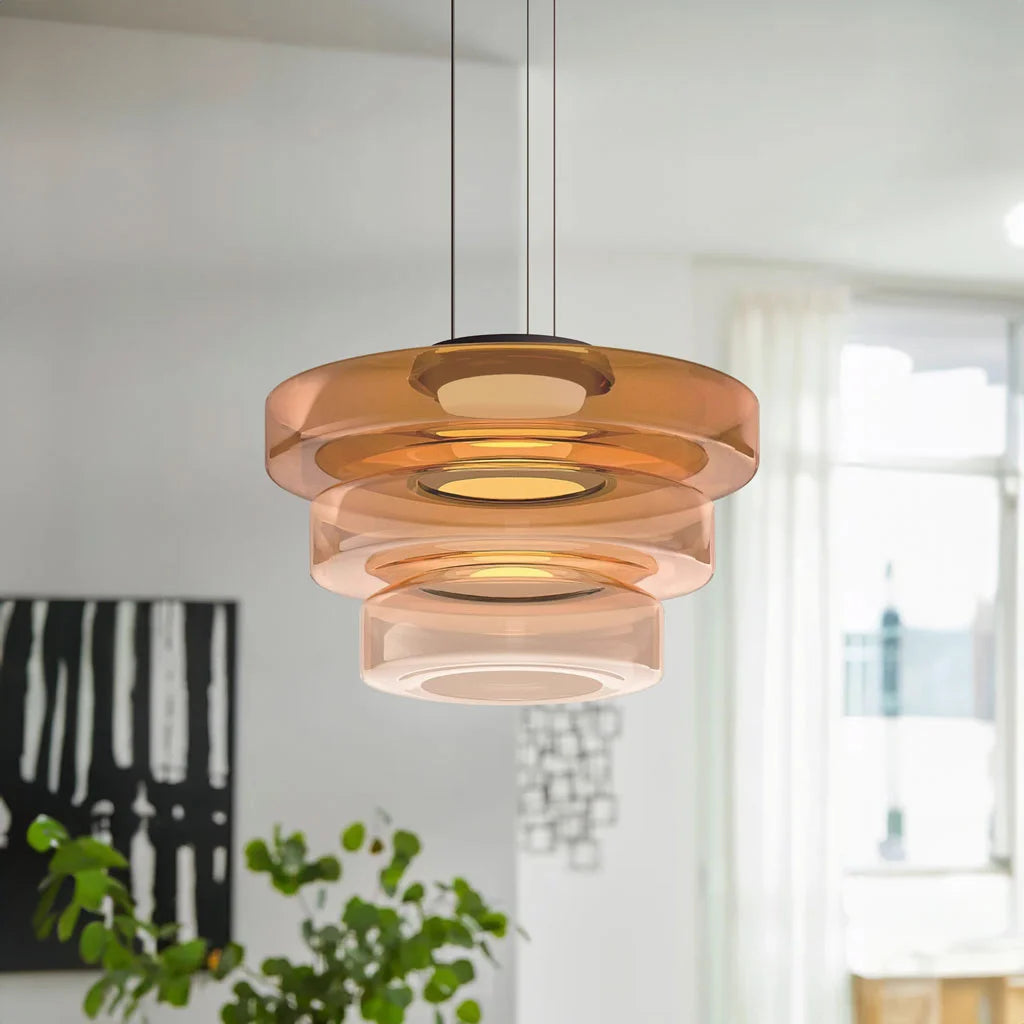 Large amber 3-layer tiered glass fujs pendant light providing a striking mid-century focal point
