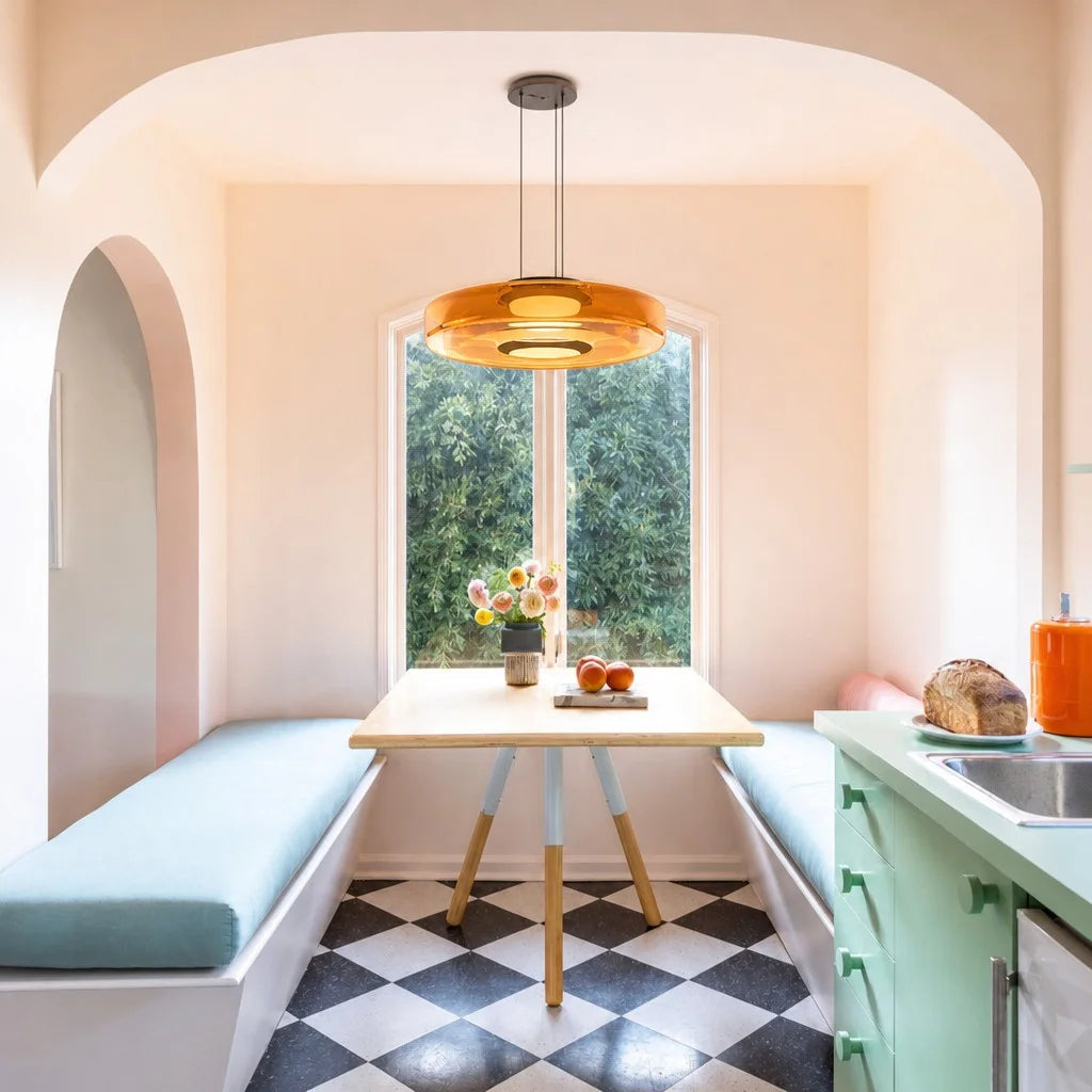 Amber fujs single-layer glass pendant light styled over a dining table in a sunlit room