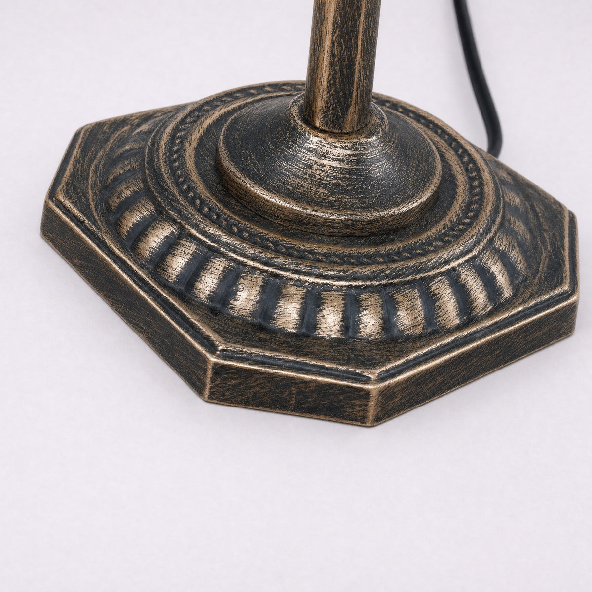Close-up of the Gemma lamp octagonal antique brass base and column