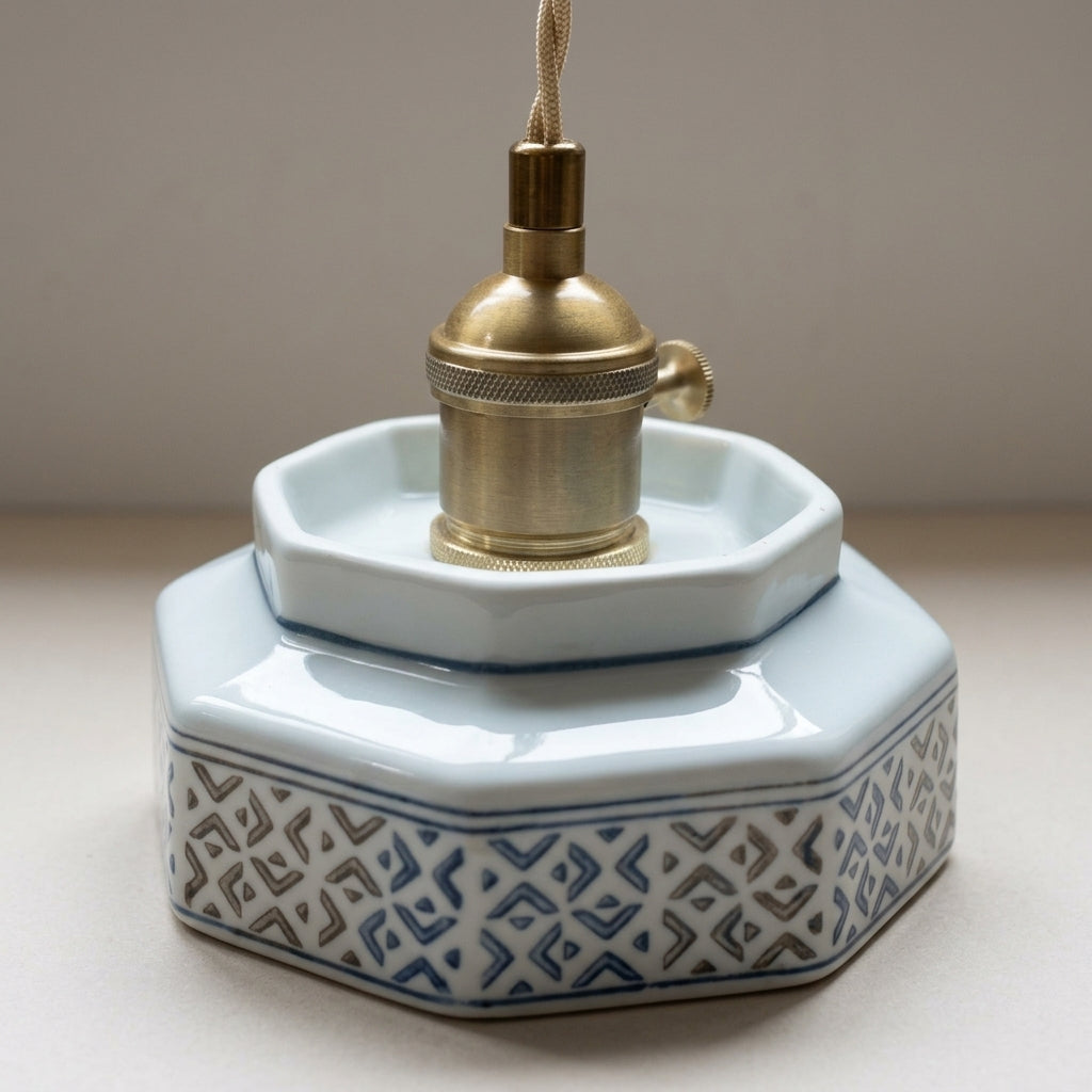 Glaze pendant light copper-finish fixture and octagonal canopy close-up, navy diamond trellis pattern, no watermark