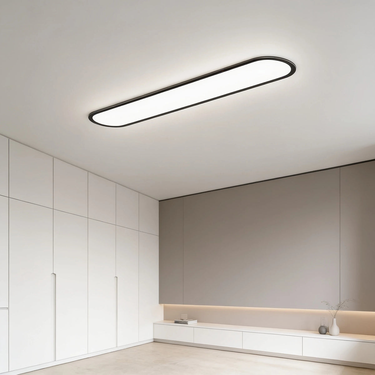 Grale black oval linear LED ceiling light in a modern hallway with built-in cupboards