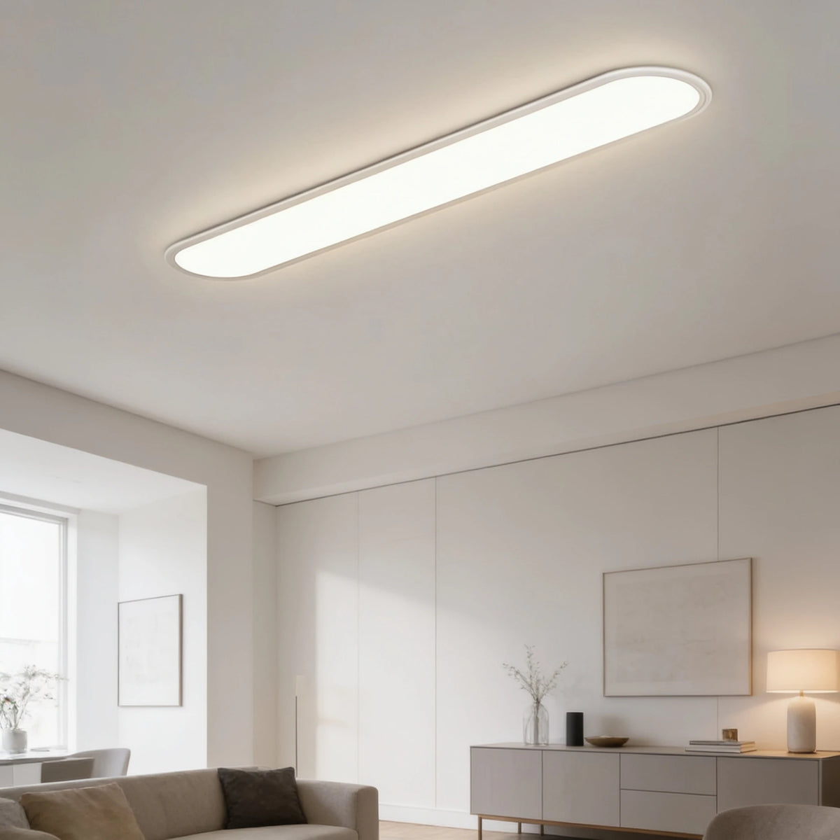 Grale white oval linear LED ceiling light in a modern living room