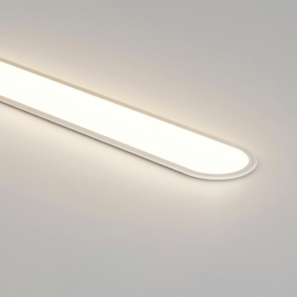 Close-up of the lit rounded end of the Grale white oval LED ceiling light