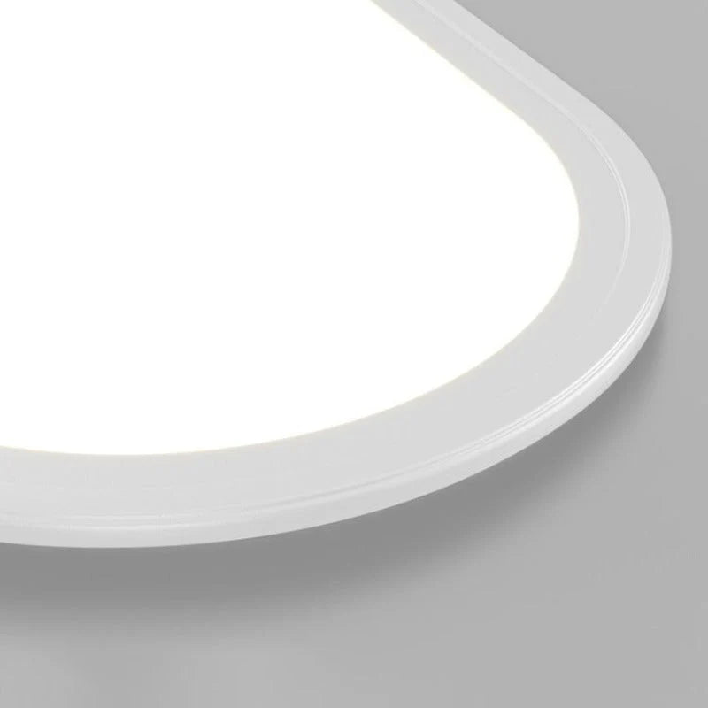 Close-up of the rounded corner and thin edge of the Grale white oval LED ceiling light