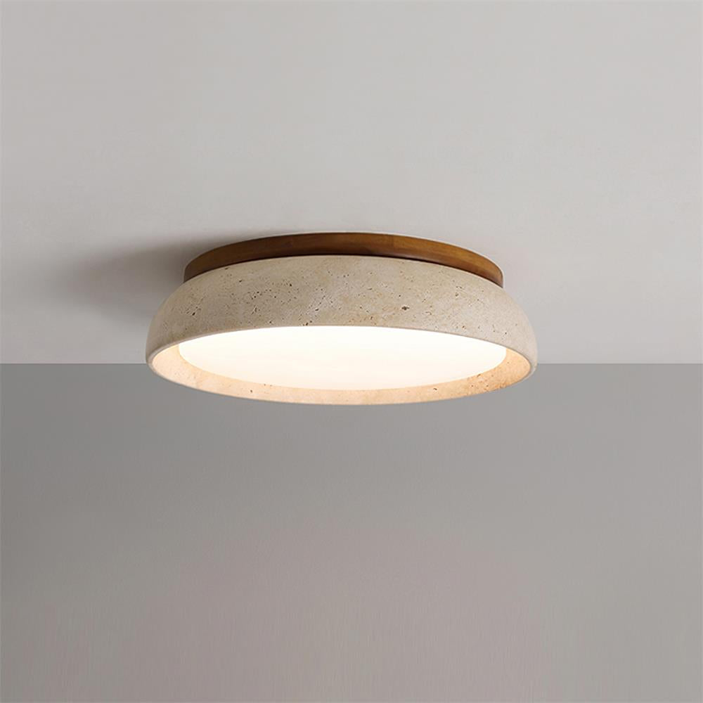 gugs illuminated travertine flush mount glowing softly on a grey ceiling