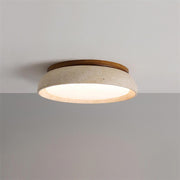 Modern round travertine and wood flush mount gugs ceiling light glowing warmly