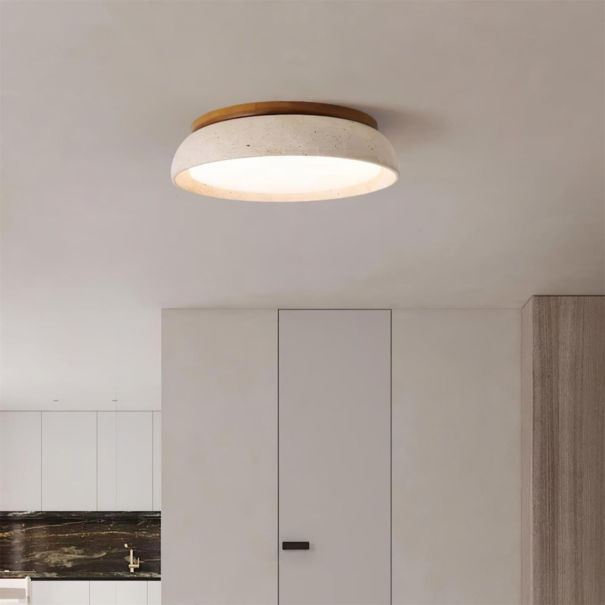 Travertine flush mount gugs ceiling light illuminating a bright modern living space
