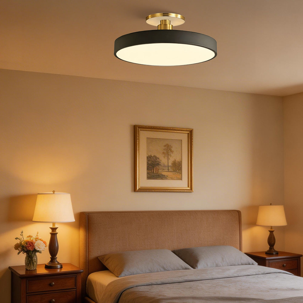 guoj black round LED semi-flush mount casting a warm ambient glow in a cosy bedroom setting