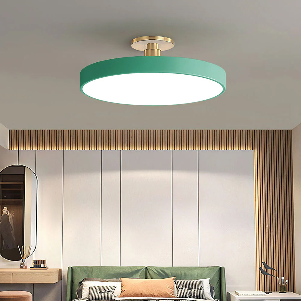 Green drum LED guoj ceiling light contrasting beautifully in a bedroom with wooden slatted walls