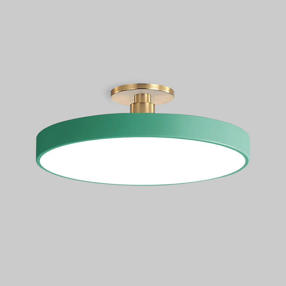 green modern round guoj ceiling lamp isolated against a light grey background