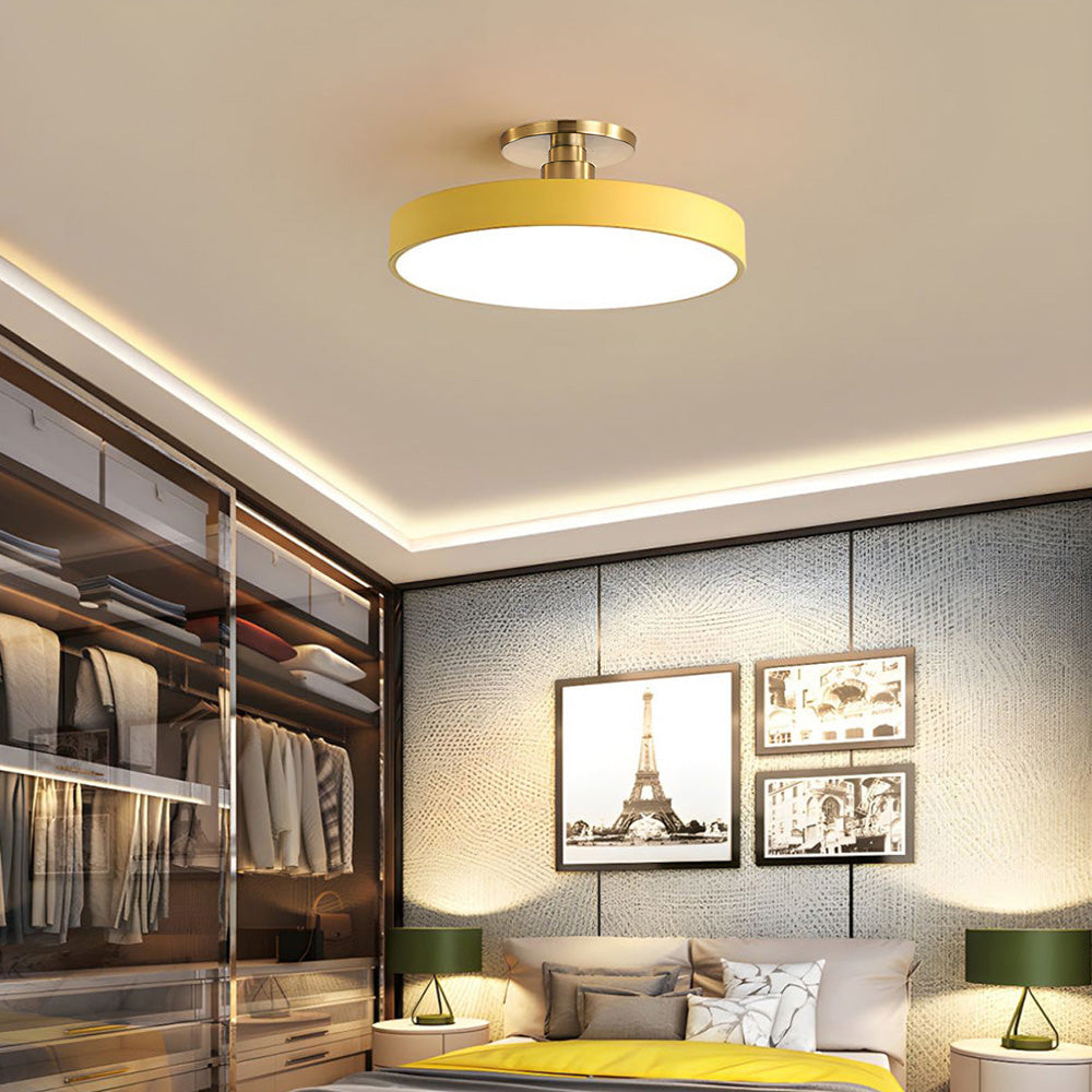 guoj vibrant yellow modern drum flush mount ceiling light illuminating a warm, neutral bedroom