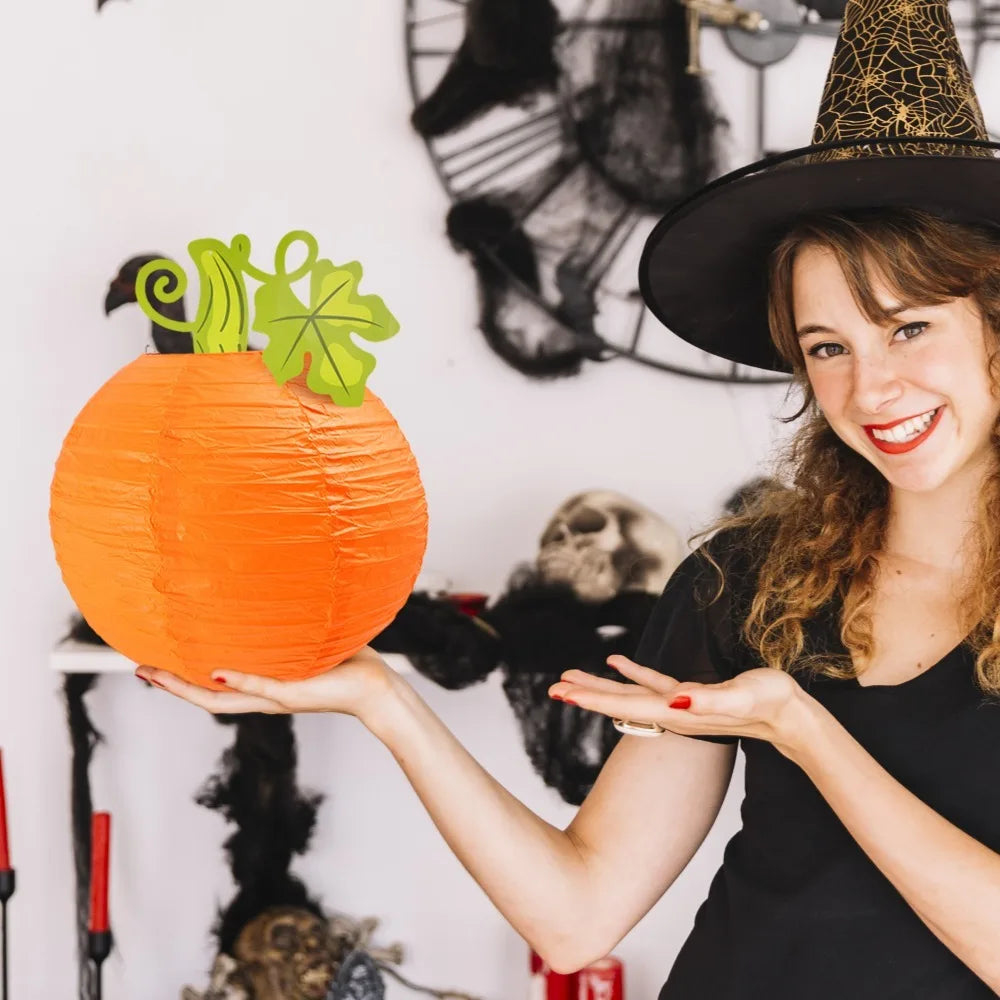 Harvest pumpkin paper lantern hanging outdoors