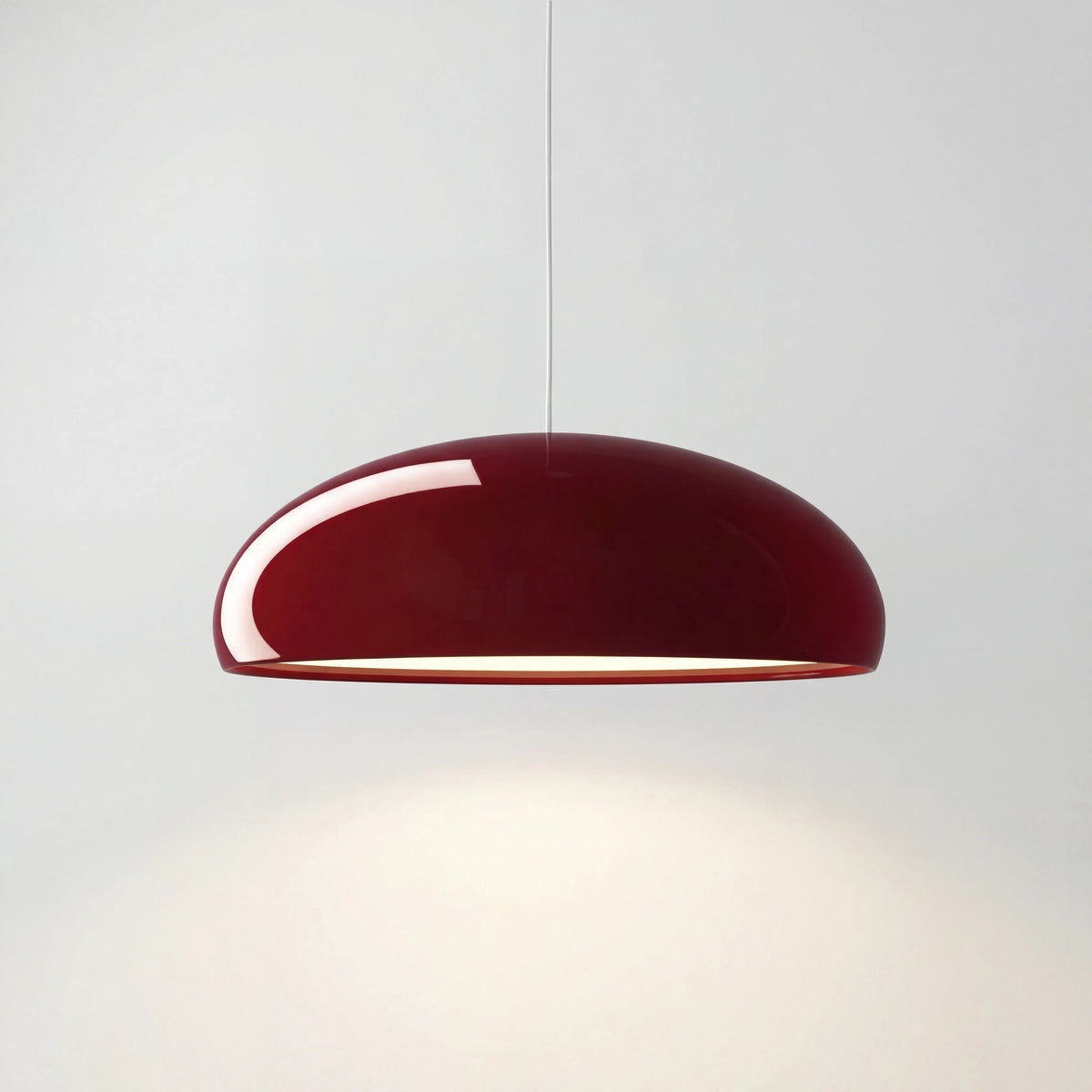 Deep red Nordic acrylic bowl huhs pendant lamp isolated on a clean white background