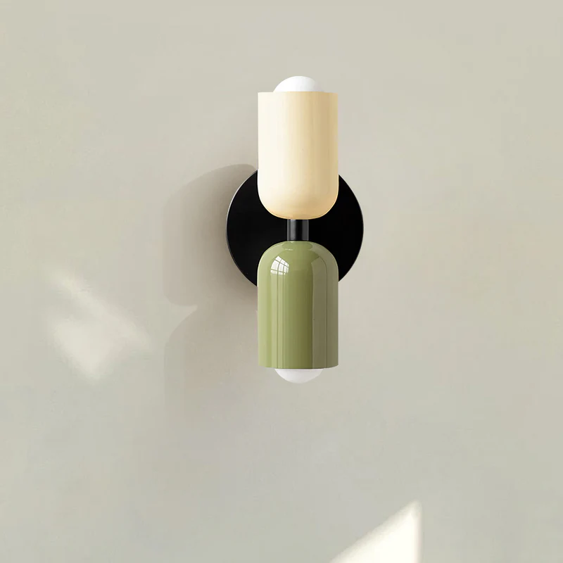 front view of the hutre beige and green glass wall lamp showing the sleek black mounting bracket