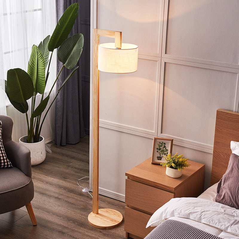 Japandi fabric shade kelta floor lamp casting a warm, glare-free glow in a relaxing bedroom setting